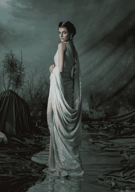 White sequin saree styled for festive and party wear with a glamorous appeal.