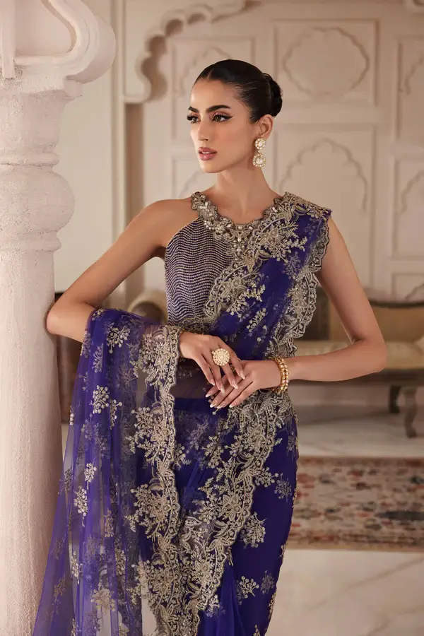 Close-up of sequin work on the blouse of a purple net saree