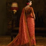 Orange and Maroon Wedding Saree back view with embroidered silk blouse