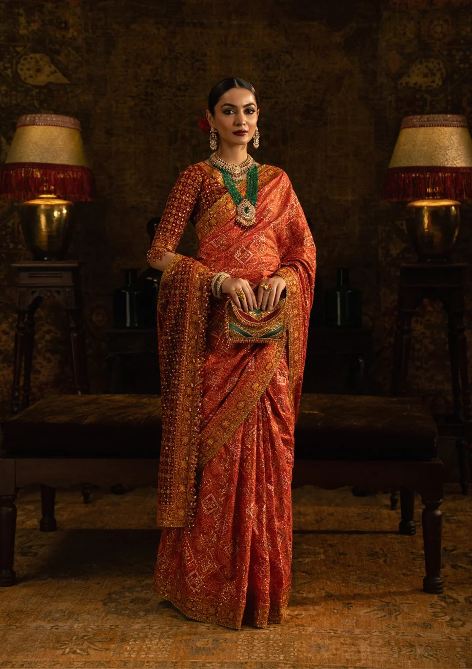 Front view of orange and maroon wedding saree stitched for brides in USA