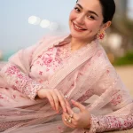 Side view of Faiza Saqlain Lamija showing embroidered lawn shirt and organza accents